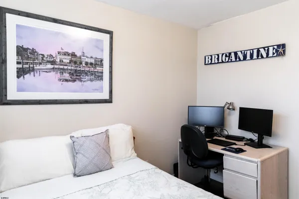 a bedroom with a bed and a dresser