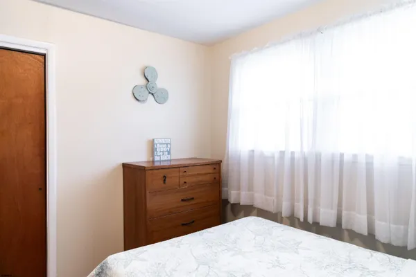 a bathroom with a sink a toilet and shower curtain