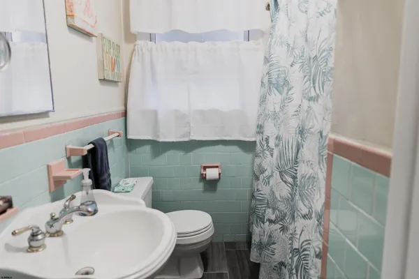 a bedroom with a bed and a lamp