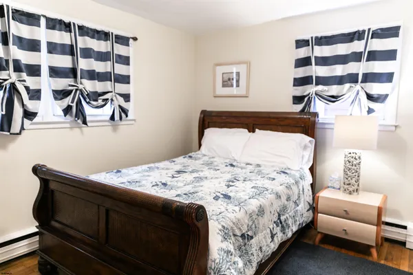 a bedroom with a bed and a bathroom