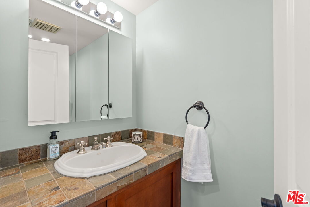 409 Adena Street, Unit 1 Pasadena, CA 91104 - Photo 11 of 26 a bathroom with a sink and a mirror