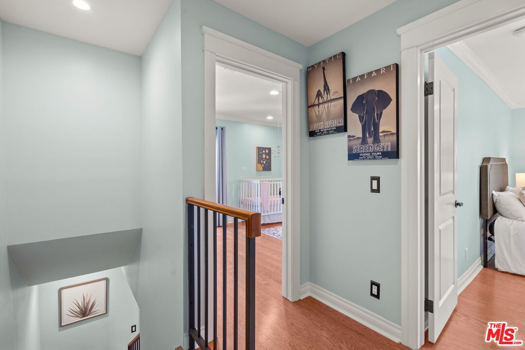 409 Adena Street, Unit 1 Pasadena, CA 91104 - Photo 13 of 26 a view of a hallway with bathroom and wooden floor