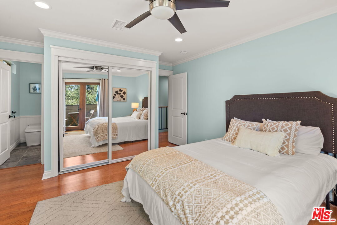 409 Adena Street, Unit 1 Pasadena, CA 91104 - Photo 15 of 26 a bedroom with a bed and glass walk in closet