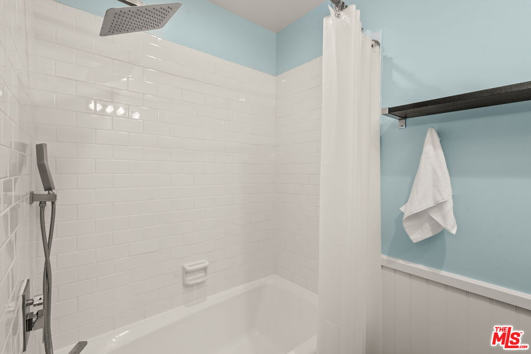409 Adena Street, Unit 1 Pasadena, CA 91104 - Photo 17 of 26 a bathroom with a white tub and shower