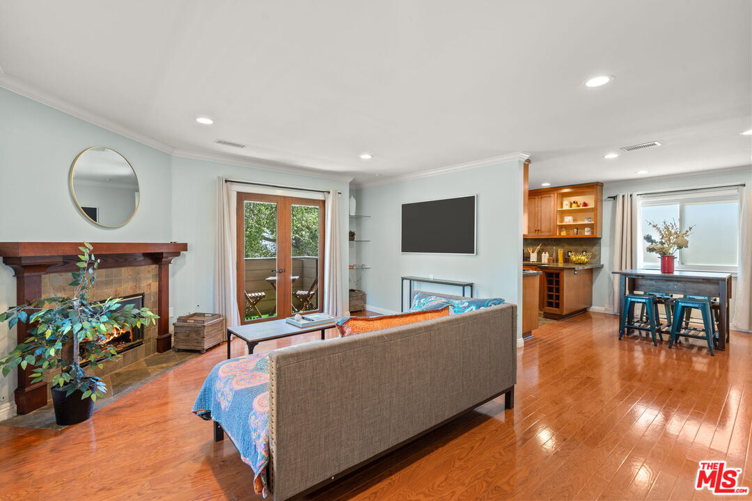 409 Adena Street, Unit 1 Pasadena, CA 91104 - Photo 2 of 26 a living room with furniture and a flat screen tv