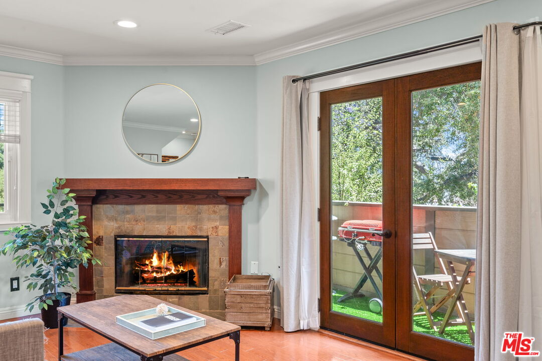 409 Adena Street, Unit 1 Pasadena, CA 91104 - Photo 4 of 26 a living room with furniture and a fireplace