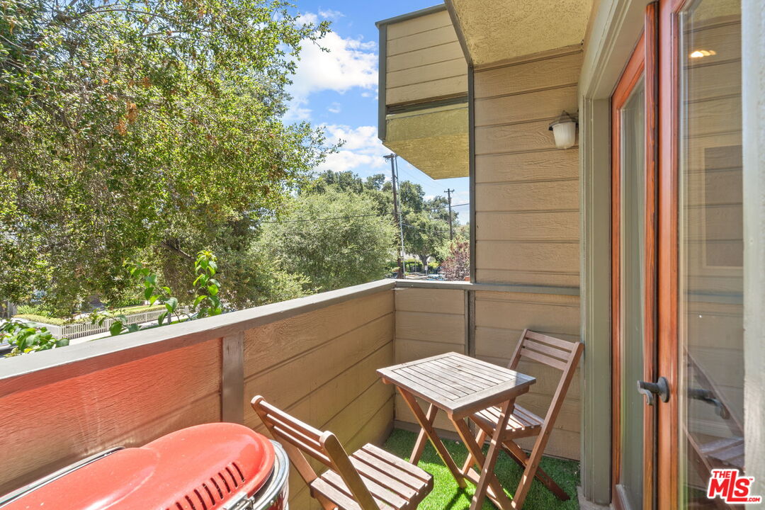 409 Adena Street, Unit 1 Pasadena, CA 91104 - Photo 5 of 26 a balcony with table and chairs