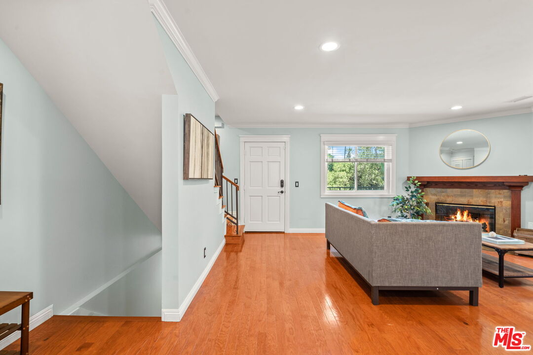 409 Adena Street, Unit 1 Pasadena, CA 91104 - Photo 6 of 26 a living room with furniture and a wooden floor