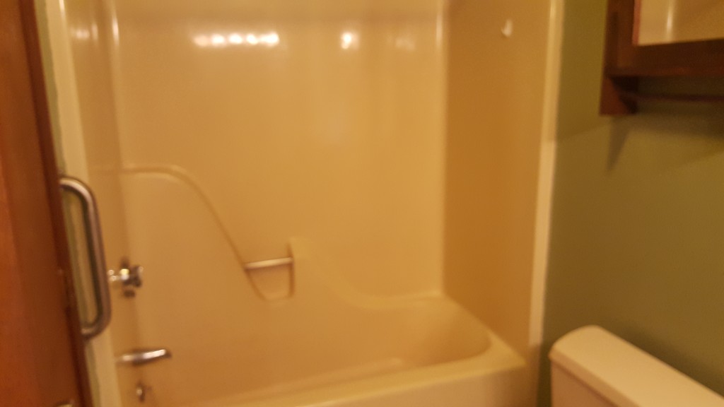 33 Cambridge Street Fall River, MA 02721 - Photo 3 of 10 a bathroom with a bathtub