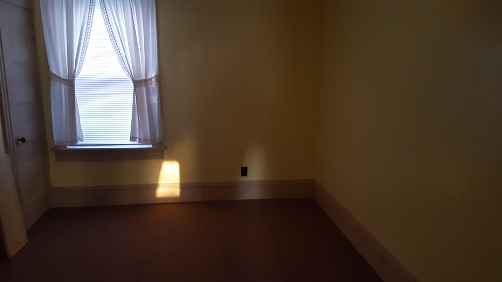 33 Cambridge Street Fall River, MA 02721 - Photo 5 of 10 a view of empty room with windows
