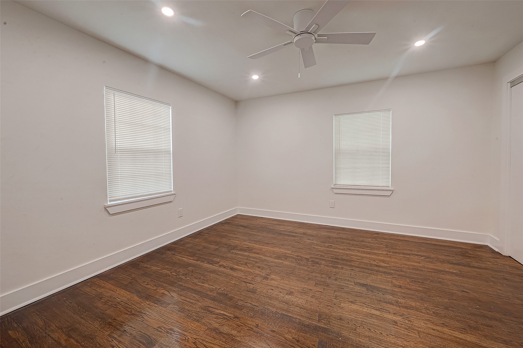 5703 Belmark Street Houston, TX 77033 - Photo 15 of 43 wooden floor in an empty room with a window