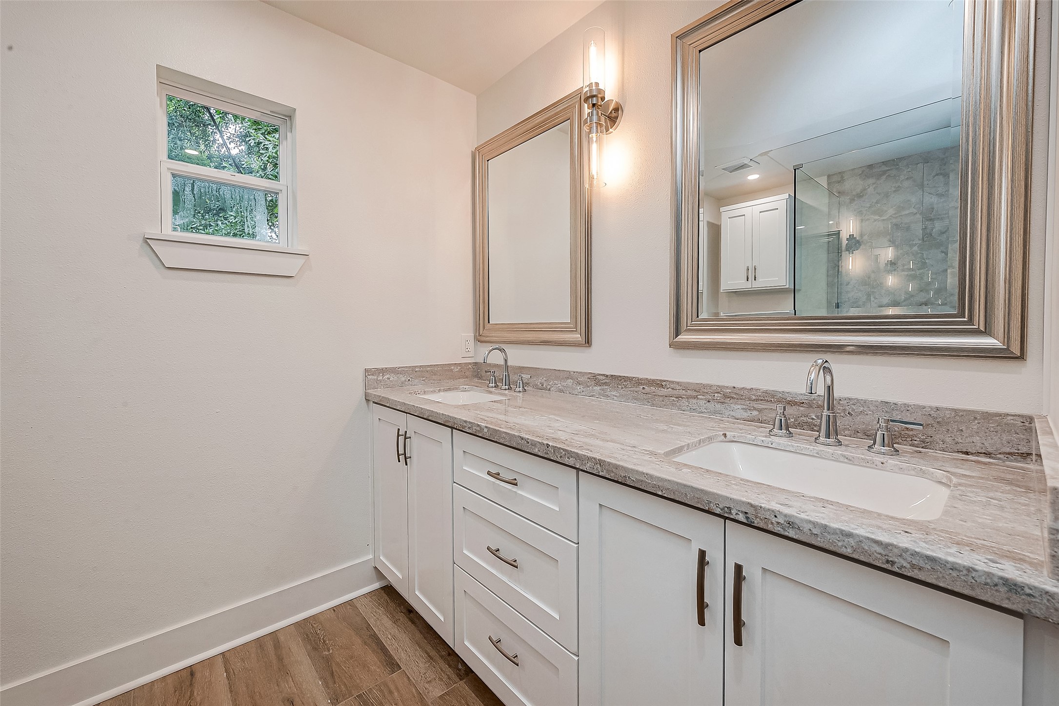5703 Belmark Street Houston, TX 77033 - Photo 20 of 43 a bathroom with a granite countertop sink and a mirror