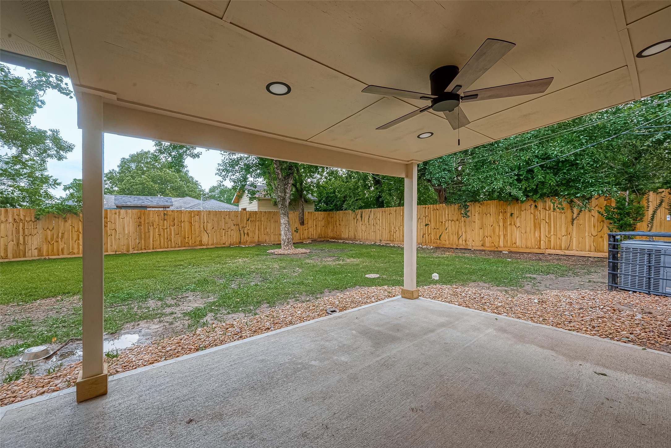 5703 Belmark Street Houston, TX 77033 - Photo 24 of 43 a view of a house with backyard and a forest