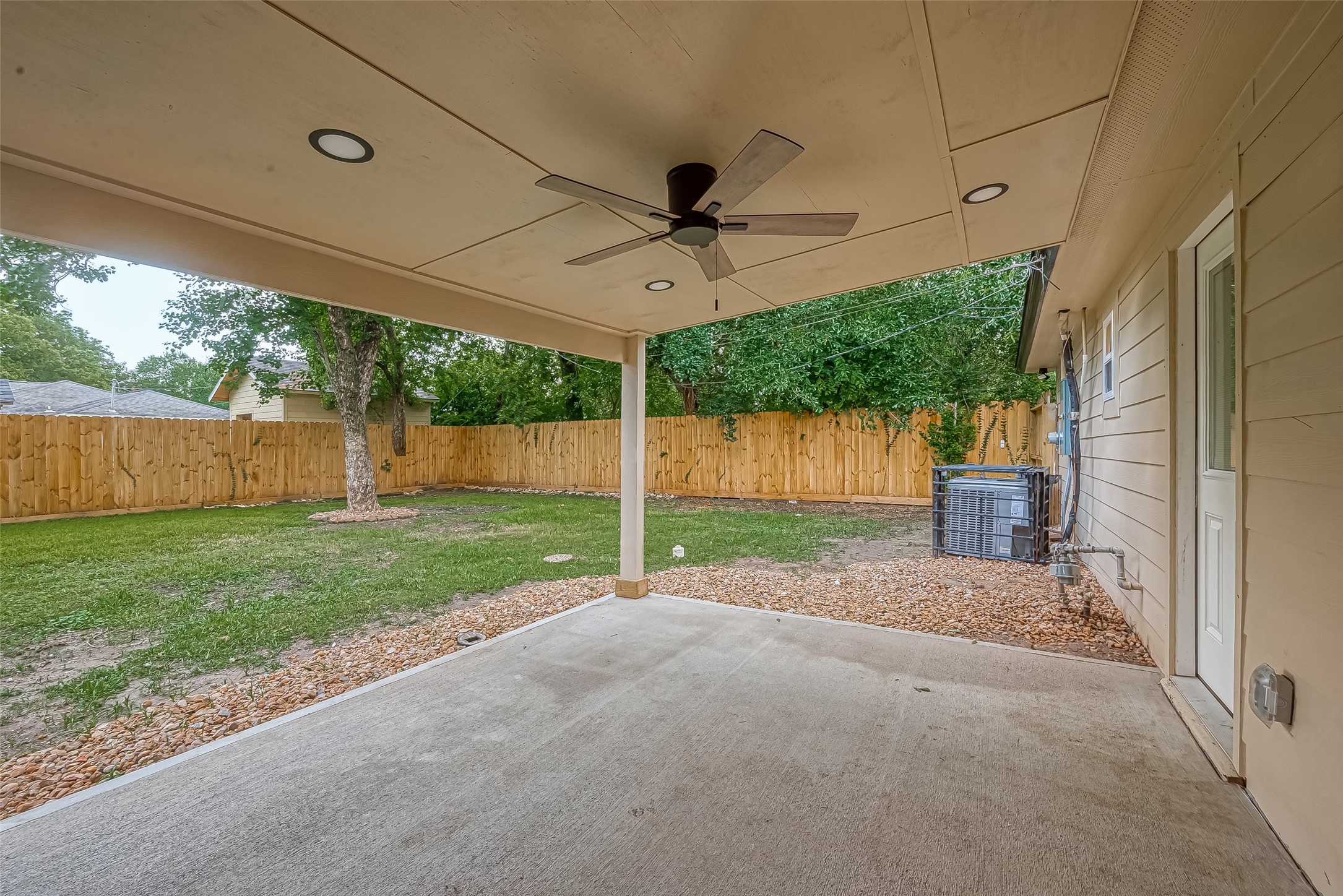 5703 Belmark Street Houston, TX 77033 - Photo 25 of 43 a view of a house with backyard and a garage