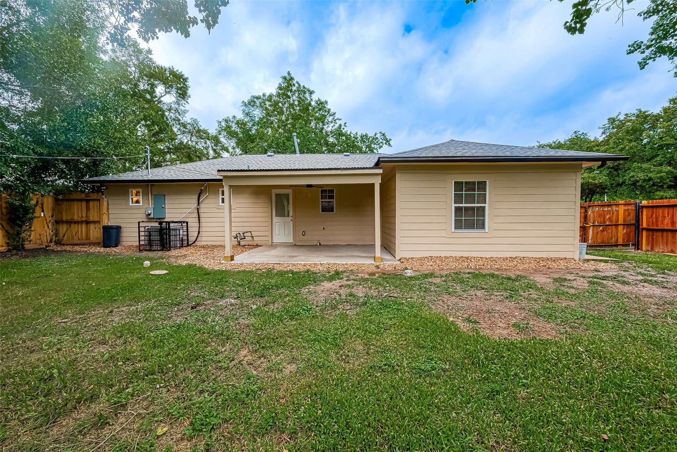 5703 Belmark Street Houston, TX 77033 - Photo 28 of 43 a front view of house with yard and green space