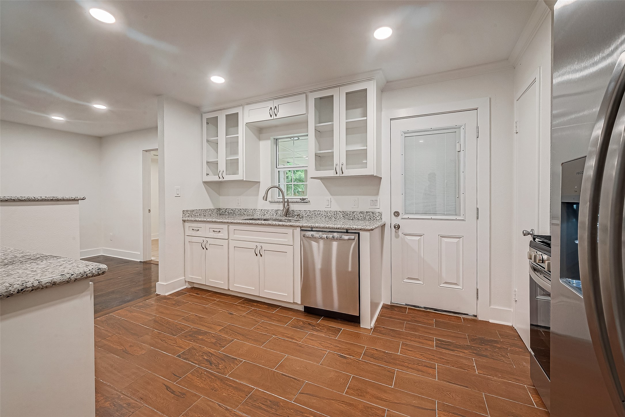 5703 Belmark Street Houston, TX 77033 - Photo 39 of 43 a kitchen with a sink stove and refrigerator