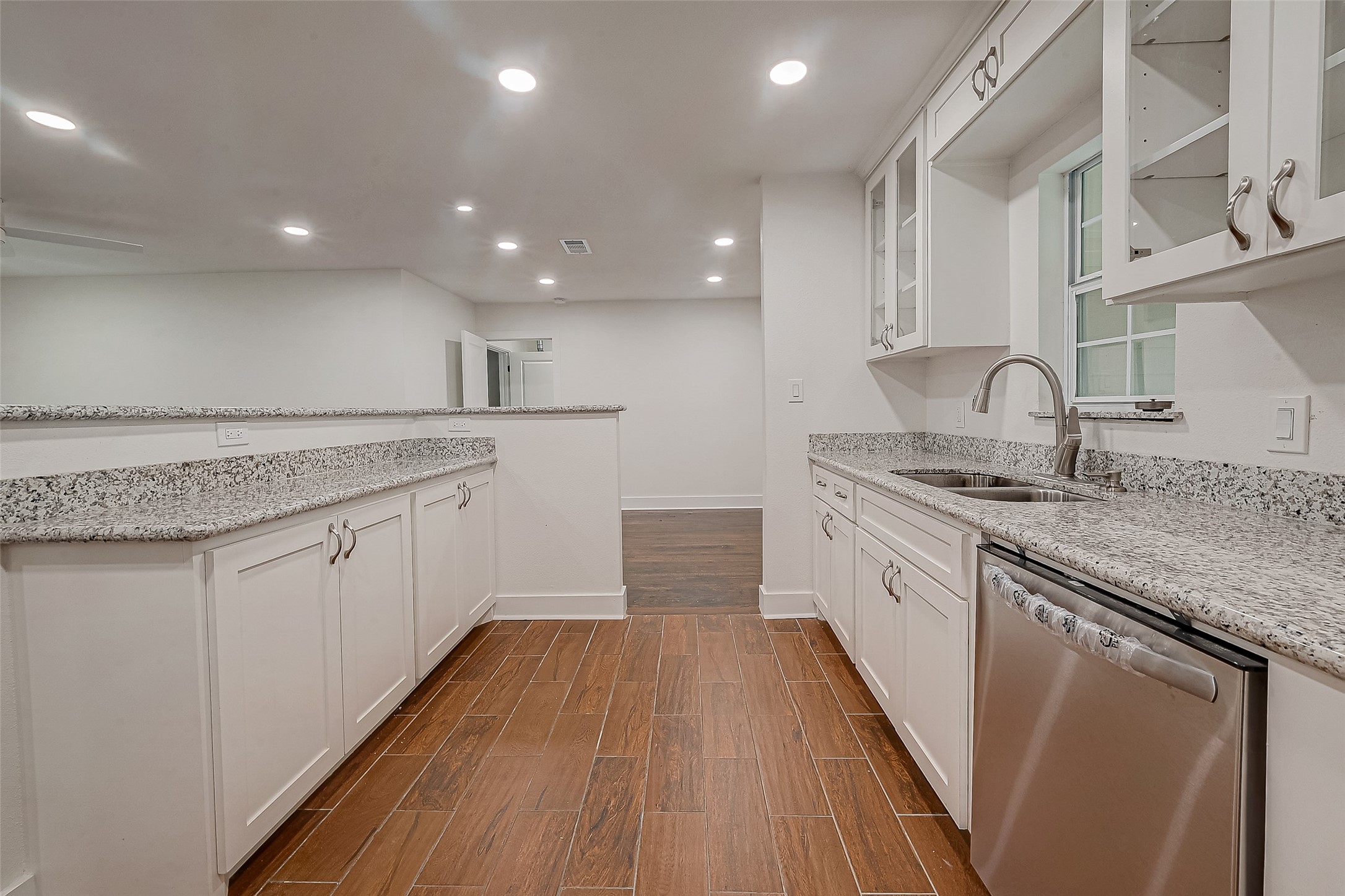 5703 Belmark Street Houston, TX 77033 - Photo 40 of 43 a kitchen with a sink microwave and cabinets
