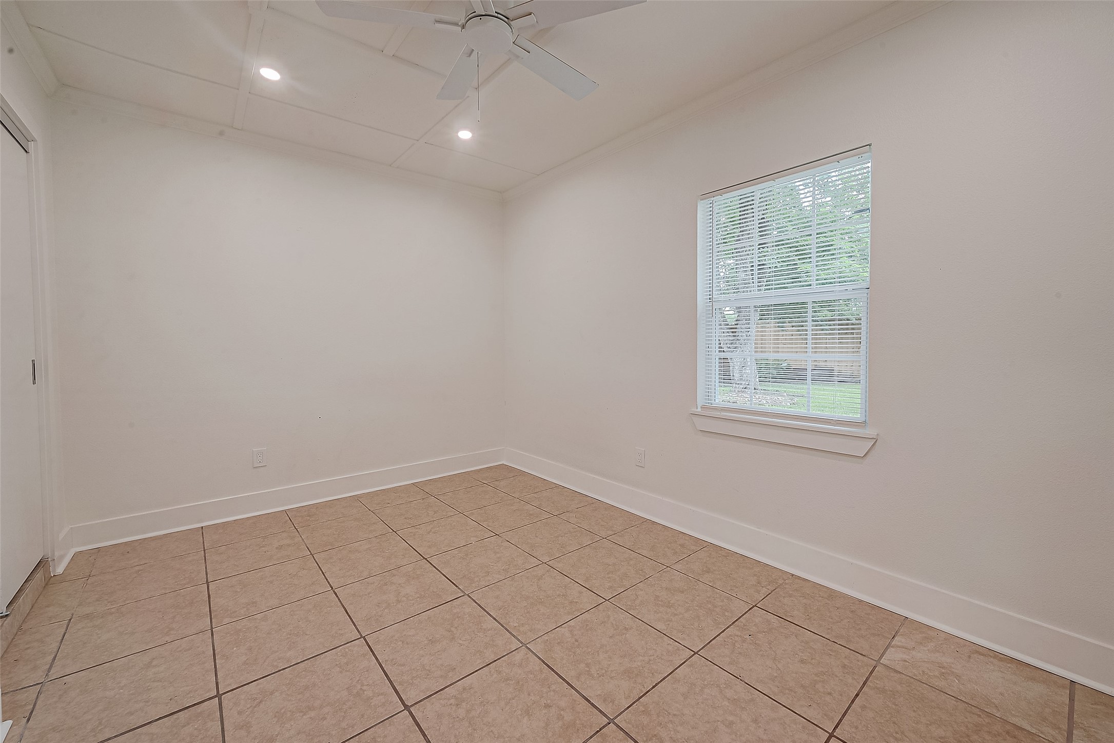 5703 Belmark Street Houston, TX 77033 - Photo 9 of 43 an empty room with windows