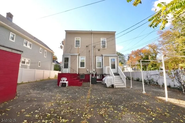 a front view of a house with outdoor seating