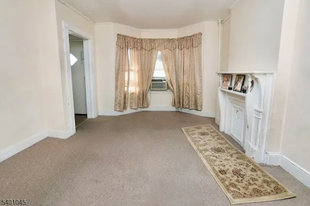 a view of an empty room and a window