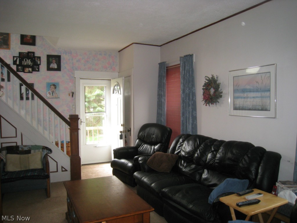 2226 7th Street Northwest Canton, OH 44708 - Photo 4 of 7 The living room enjoys good space, very good natural lighting and views of the front and back yards.