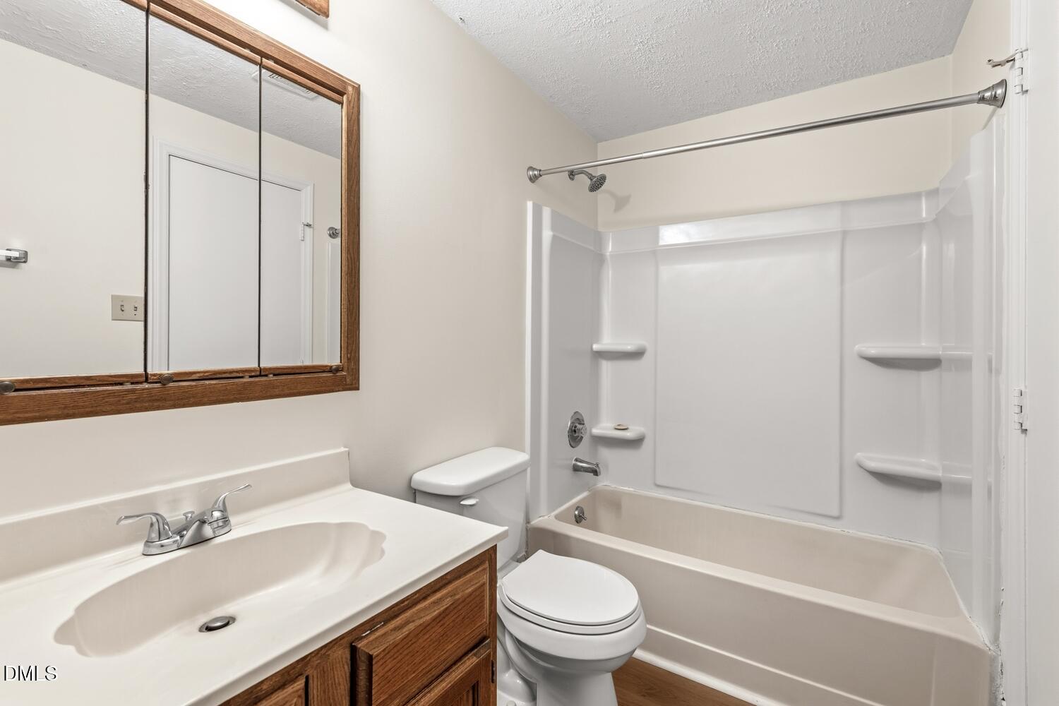 1135 Villa Green Court Raleigh, NC 27612 - Photo 15 of 17 a bathroom with a sink toilet and shower