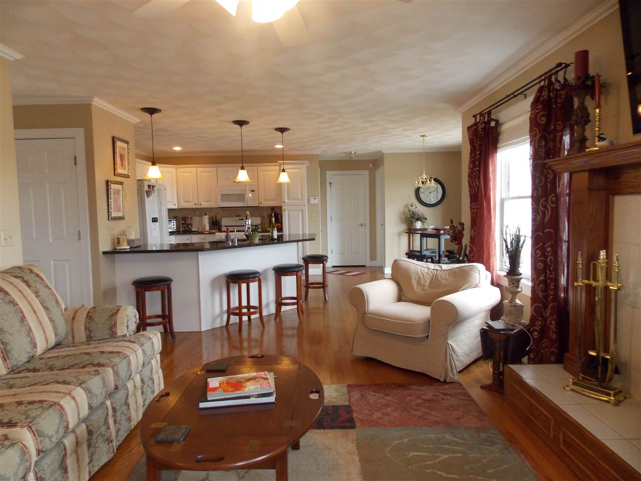4373 Ridgeview Lane Byron, IL 61010 - Photo 12 of 22 a living room with furniture and a view of kitchen