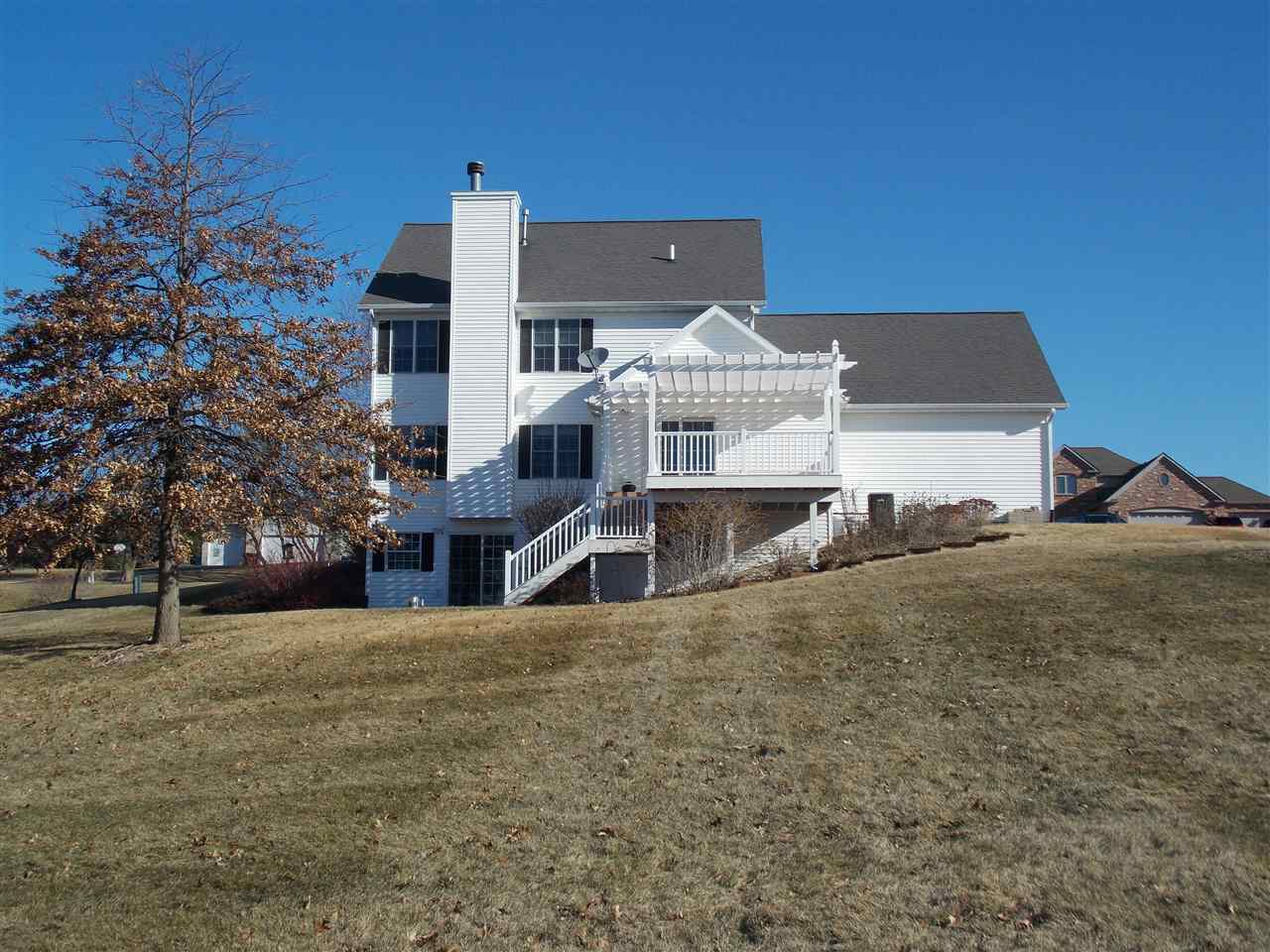 4373 Ridgeview Lane Byron, IL 61010 - Photo 20 of 22 a front view of a house with a yard