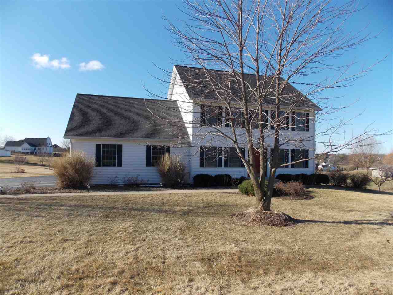 4373 Ridgeview Lane Byron, IL 61010 - Photo 21 of 22 a house that has a tree in front of it