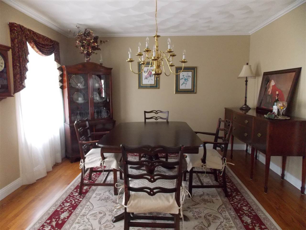 4373 Ridgeview Lane Byron, IL 61010 - Photo 9 of 22 a view of a dining room with furniture and chandelier