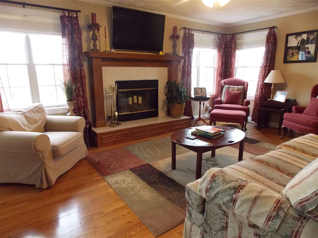 4373 Ridgeview Lane Byron, IL 61010 - Photo 10 of 22 a living room with furniture a window and a fireplace