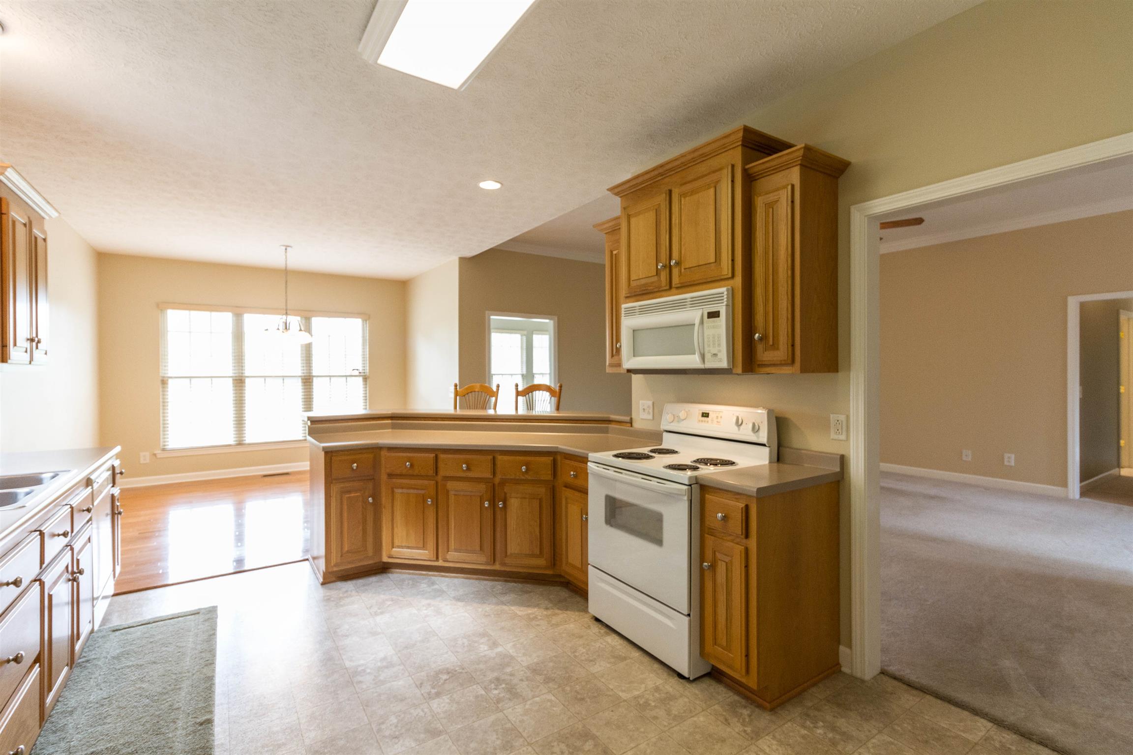 6019 Ebenezer Road Greenbrier, TN 37073 - Photo 11 of 25 a kitchen with stainless steel appliances granite countertop a stove and a sink