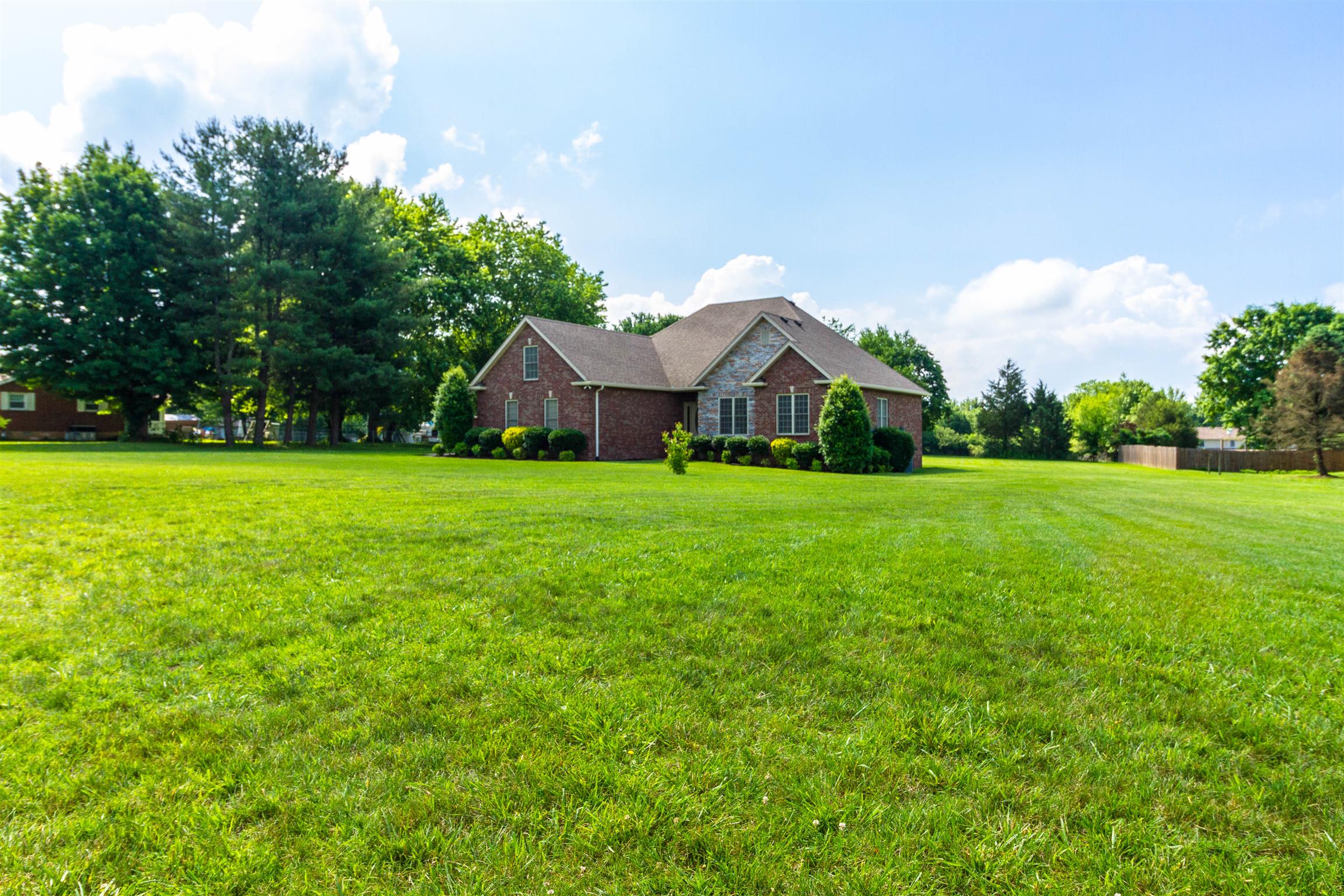 6019 Ebenezer Road Greenbrier, TN 37073 - Photo 3 of 25 a view of a house with a yard and garage