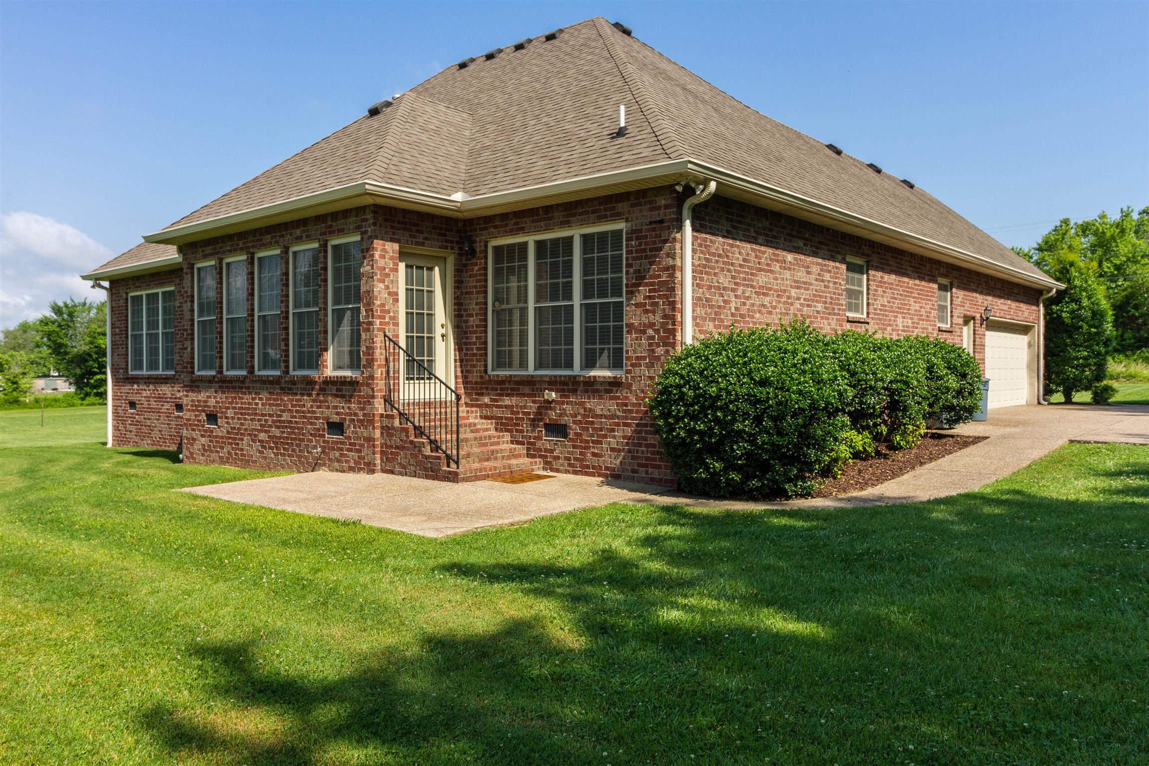 6019 Ebenezer Road Greenbrier, TN 37073 - Photo 5 of 25 a front view of a house with garden and porch