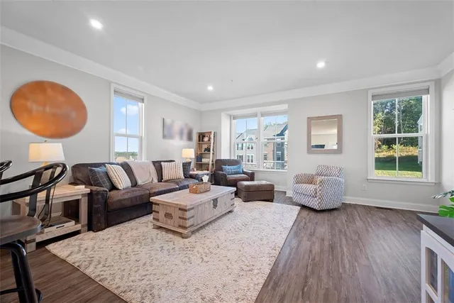 a living room with furniture or couch and a large window