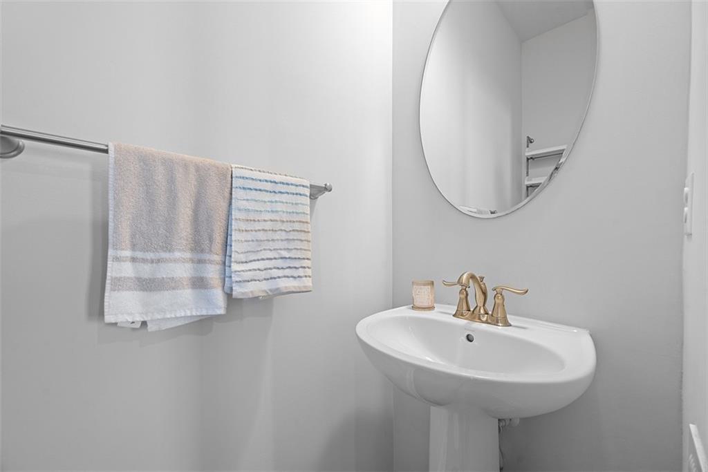 131 Cole Drive McKees Rocks, PA 15136 - Photo 16 of 42 a bathroom with a sink and a mirror