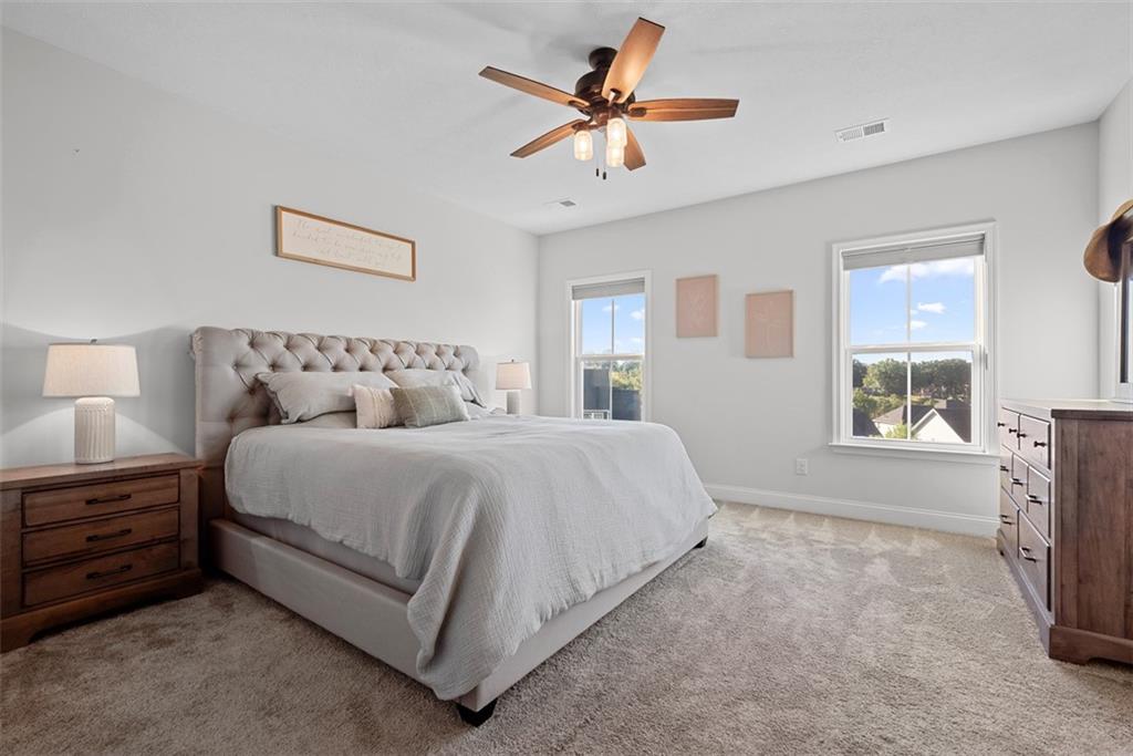 131 Cole Drive McKees Rocks, PA 15136 - Photo 18 of 42 a bedroom with a bed a chandelier and a window