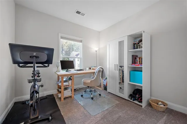 a view of a workspace with furniture