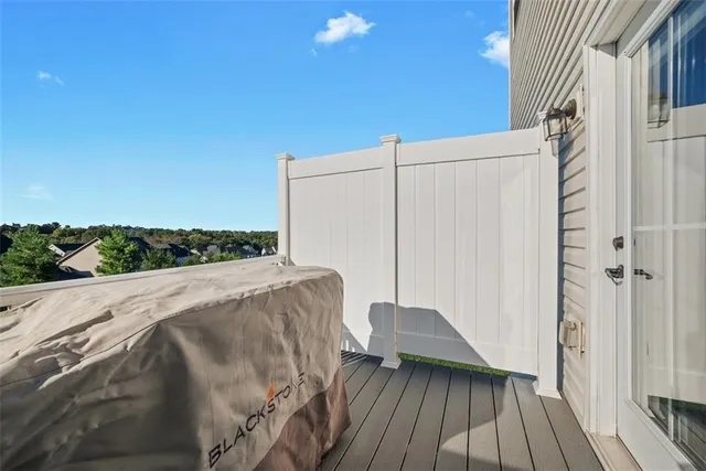 a view of balcony with wooden floor