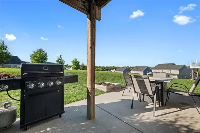 a view of a terrace with furniture and garden
