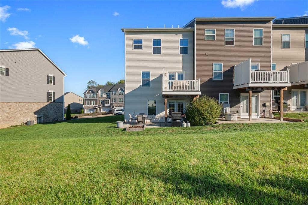 131 Cole Drive McKees Rocks, PA 15136 - Photo 36 of 42 a view of a house with backyard porch and sitting area