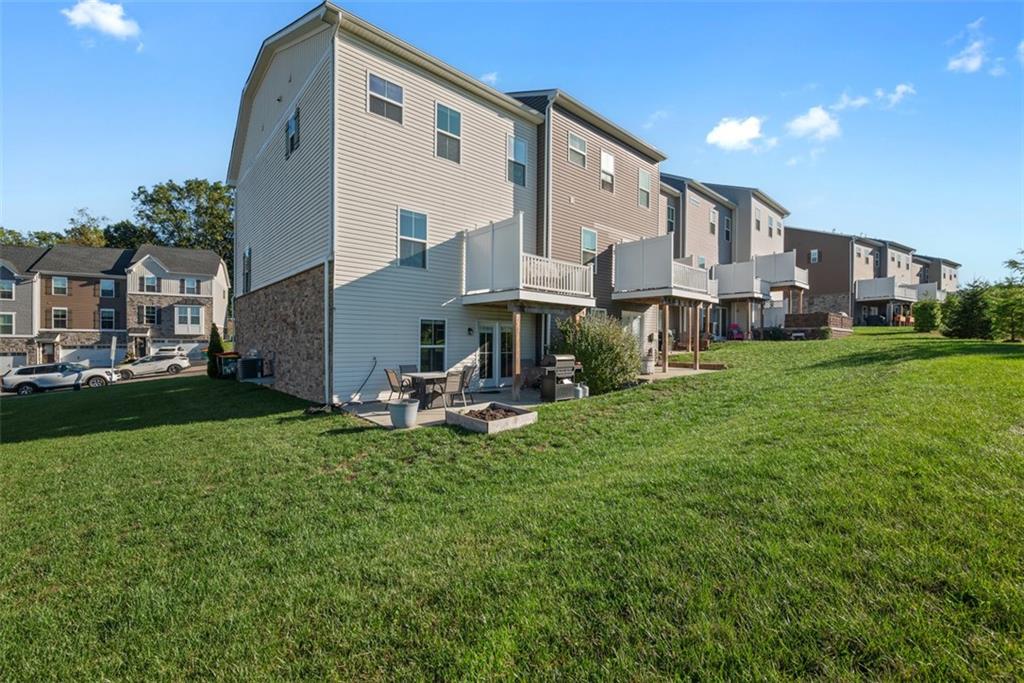 131 Cole Drive McKees Rocks, PA 15136 - Photo 37 of 42 a front view of a house with a yard fire pit and outdoor seating