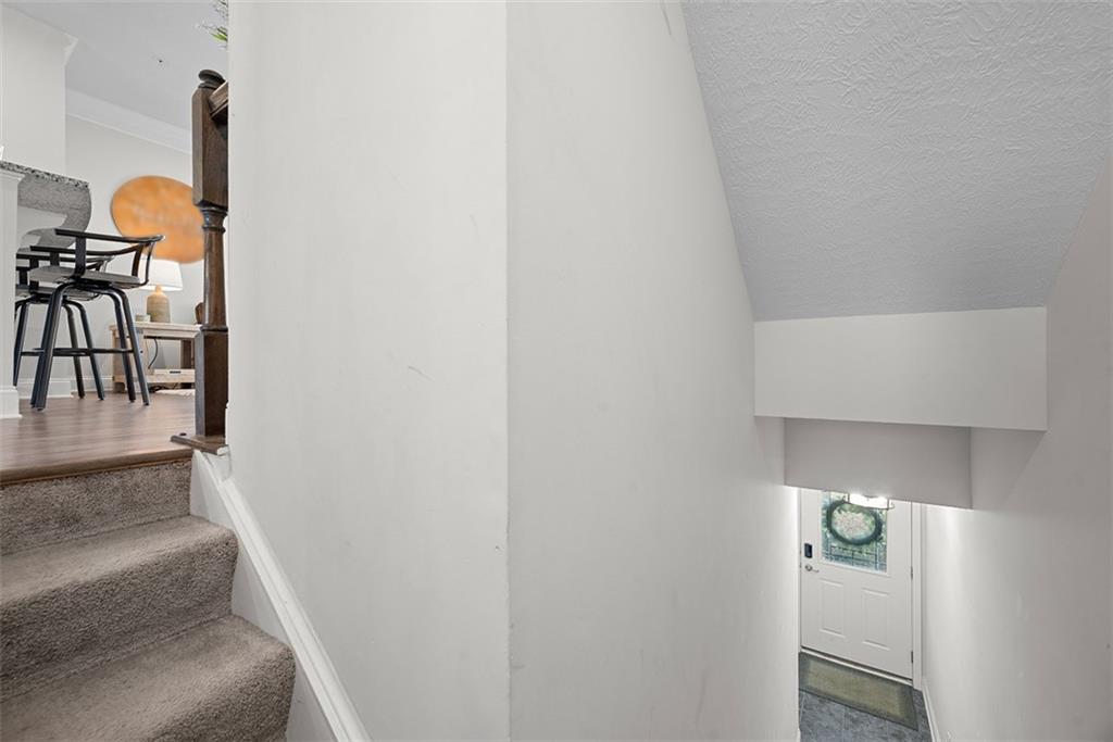 131 Cole Drive McKees Rocks, PA 15136 - Photo 5 of 42 a bathroom with a light fixture and a sink