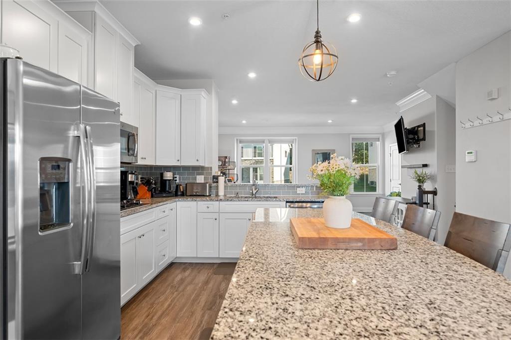 131 Cole Drive McKees Rocks, PA 15136 - Photo 9 of 42 a large white kitchen with lots of counter top space appliances and cabinets