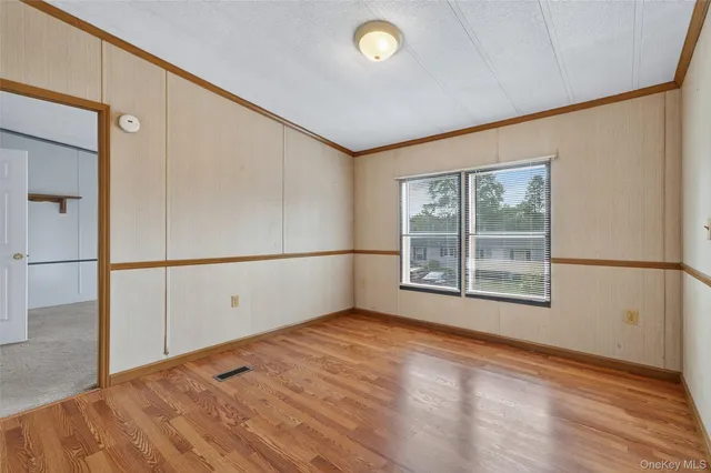 a room with window and cabinet