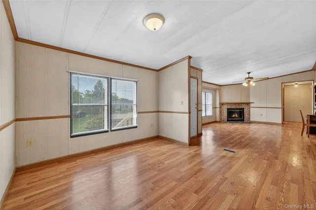a view of a livingroom with a refrigerator