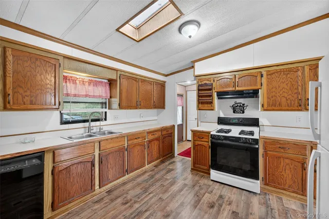 a view of washer and dryer with bathroom in it