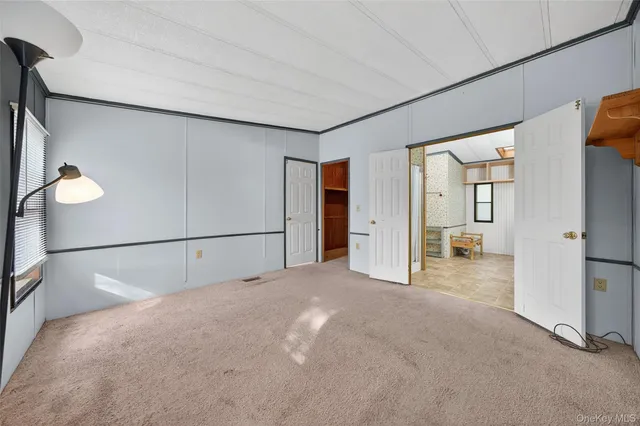a living room with furniture a chandelier and a fireplace