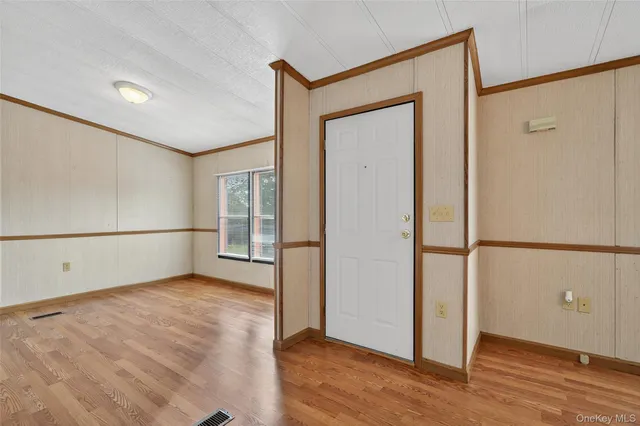 a living room with furniture wooden floor and a fireplace