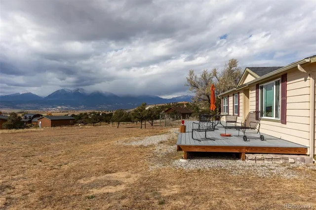 a view of a patio with a city view